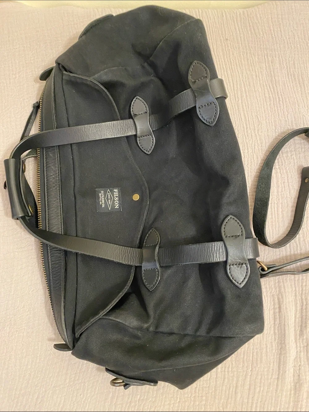 FILSON  BLACK TWILL DUFFLE BAG .
